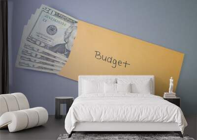 A yellow envelope on a gray table, containing cash for personal budget. Wall mural