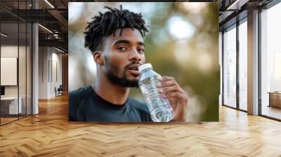 African american man drinking protein or water during break after outdoor workout. Copy space, Generative AI Wall mural