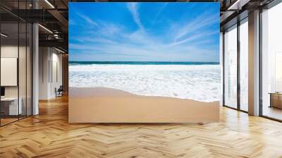 Beautiful view of ocean waves washing over beach sand on a warm summer day Wall mural