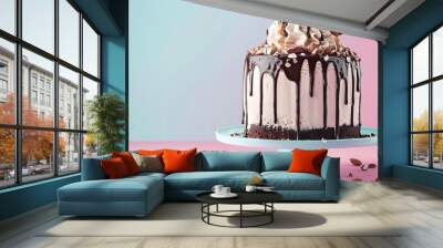 Cookie dough ice cream cake with chocolate sauce and crushed almonds isolated on pink and blue background Wall mural