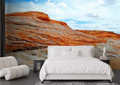 Sandstone Strata - Close-up view of weathered sandstone formations against a blue cloud covered sky. Wall mural