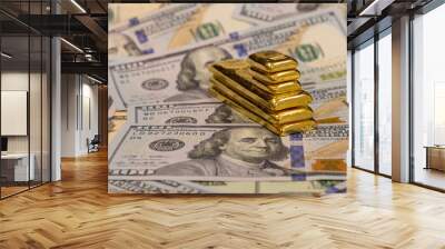 pile of long and short pure gold bars, bullion, ingot on background of us dollar banknotes Wall mural