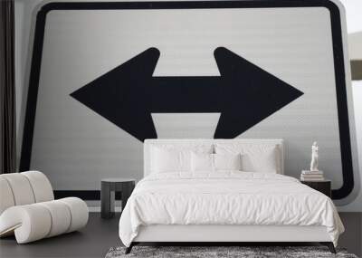 Photo of a rectangular sign with arrows Wall mural