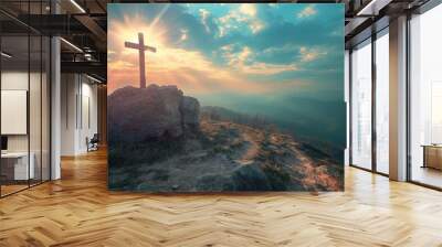 Silhouettes of crucifix symbol on top mountain with bright sunlight on the colorful sky background. Wall mural