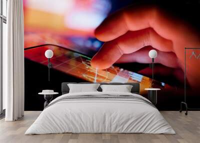 A Person using a portable device to display business data. Mobile Technology concept. Wall mural