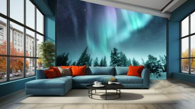 The Aurora Northern Lights flicker in the winter night sky above a forest in Sweden. Photo Composite. Wall mural