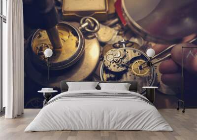 Watchmakers Craftmanship. A watch maker repairing a vintage automatic watch. Wall mural