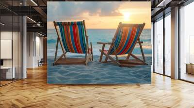 Two striped deck chairs on the beach with sea and sky in background, summer vacation concept, copy space for text. Wall mural