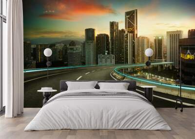 Blue neon light design highway overpass with modern city background .Early morning scene . Wall mural