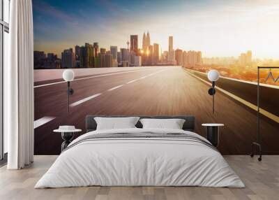 Highway overpass motion blur with city skyline background . Sunset scene . Wall mural