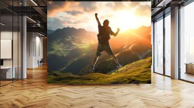 Jumping man on the mountain peak Wall mural