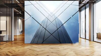 Low angle view of generic modern office skyscrapers ,high rise buildings with abstract geometry glass facades on a bright sunny day . Concepts of finances and economics background. 3d rendering . Wall mural