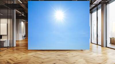 Shining sun with rays and clear blue sky Wall mural