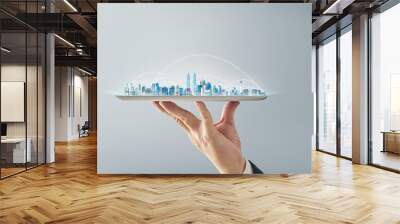 Waiter hand holding an empty digital tablet with smart cityscape and network connection concept .  Isolated on grey background . Wall mural