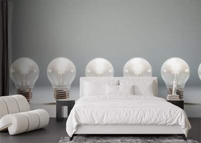 A row of light bulbs with one green bulb standing out Wall mural