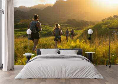 Group of people jogging through the green hills in the morning.  Wall mural