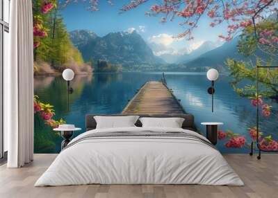 the edge of a tranquil lake nestled amidst towering mountains and lush spring foliage Wall mural