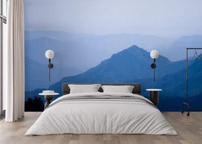 Beautiful landscape of blue mountains layers with clouds Wall mural