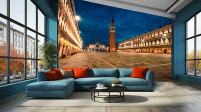 Night view of St. Mark's Square (San Marco) with its famous cathedral and bell tower with illuminated buildings Wall mural