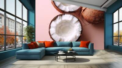 Close-up of coconut split in halves, highlighting the fresh and natural texture of this tropical fruit. Wall mural