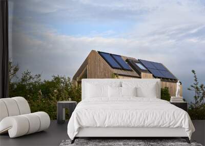 environmentally friendly eco house with solar cells and photovoltaic. sustainable vacation home in n Wall mural