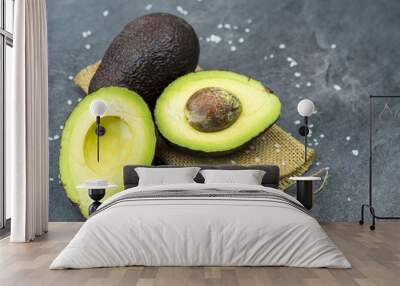 fresh avocado on black old wooden table. Wall mural