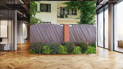 Fence made of stone and wooden boards Wall mural