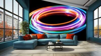 Multicoloured circular light trails on black, forming a vibrant, energetic ring pattern, symbolising movement, energy, and digital aesthetics. Wall mural