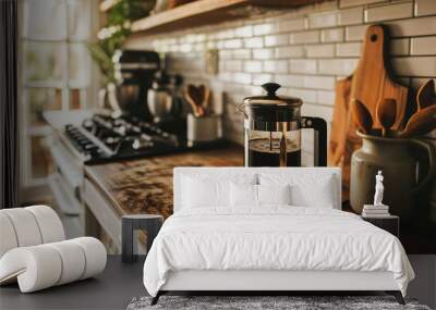 Sunlight bathes a French press on a wooden countertop, evoking a warm, inviting morning coffee scene. Wall mural