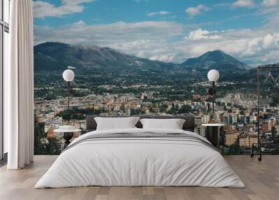 town under the mountains and blue sky Wall mural