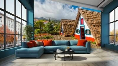 Traditional historic thatched houses with strawy roofs on Madeira island, Santana, Portugal Wall mural