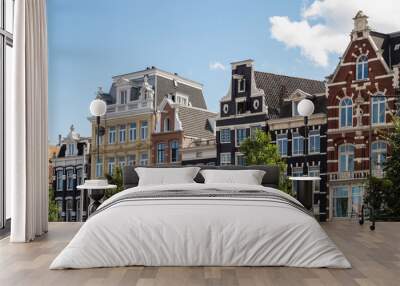 Historic facades of the canal houses along the river Amstel in Amsterdam. Wall mural