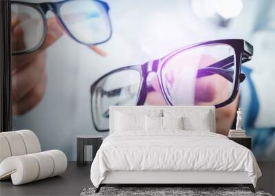 Doctor with glasses in hand Wall mural