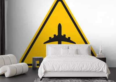 Vector yellow triangle sign - black silhouette aircraft symbol. Isolated on white background.  Wall mural