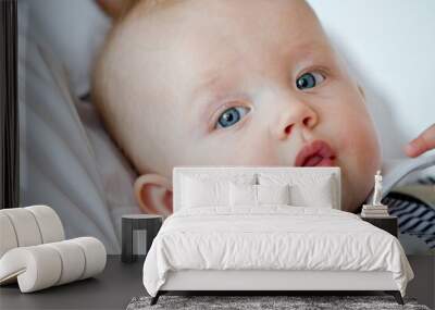 Closeup indoor portrait of a cute happy toddler boy with blue eyes	 Wall mural