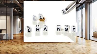 Removing white cubes with a tweezer with letters l and e of the word challenge creating new word change on white background with miniature figurines Wall mural