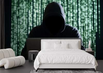 Hacker silhouette in black hoodie with laptop and rapidly changing green digital code background Wall mural