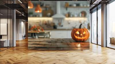 Halloween pumpkin on wooden table with blurry kitchen background Wall mural