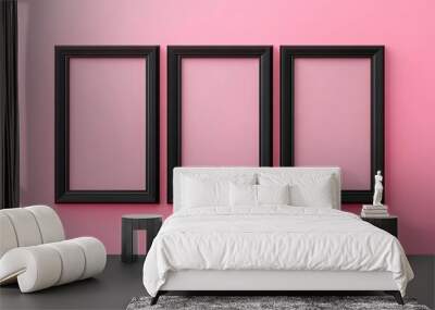 Three black picture frames on pink background Wall mural