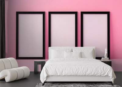 Three black picture frames on pink background Wall mural