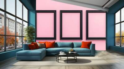 Three black picture frames on pink background Wall mural