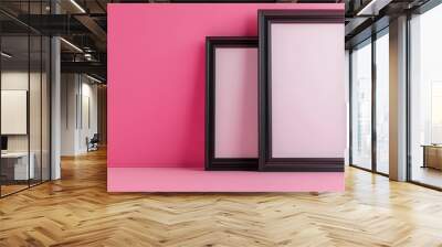 Two black picture frames on pink background Wall mural