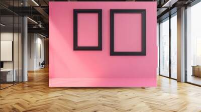 Two black picture frames on pink background Wall mural