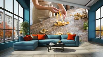 Raw homemade pasta and hands Wall mural