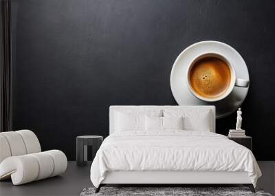 Minimalist flat lay of cup of coffee on black background with copy space, perfect for modern lifestyle concepts Wall mural