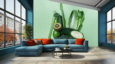 Fresh green vegetables and fruits for a healthy smoothie or alkaline diet. Equilibrium floating food balance. Wall mural