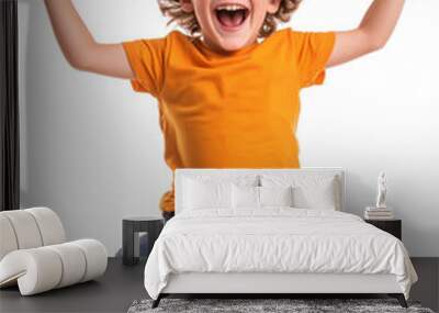 Young boy jumping with joy in orange t-shirt and blue jeans isolated on transparent background

 Wall mural