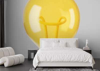 3d yellow light bulb icon isolated on gray background. Render cartoon style minimal yellow transparent glass light bulb. Creativity idea, business success, strategy concept. 3d realistic vector Wall mural