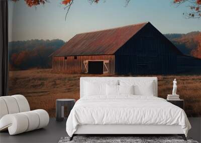 A rustic barn sits in a field of tall grass Wall mural