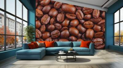  A close-up view displays a mound of roasted coffee beans Wall mural